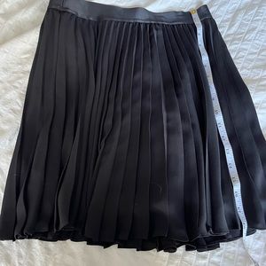 Express very classic pleading black skirt with elastic waist band , lining
